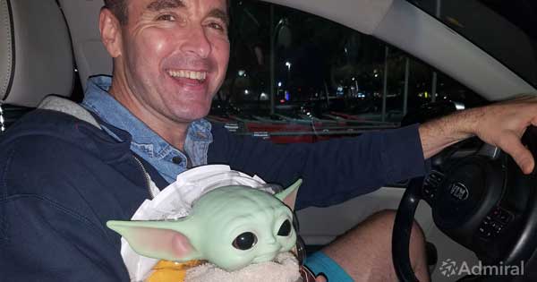 Admiral CEO Dan Rua with Baby-Yoda for Toys for Tots